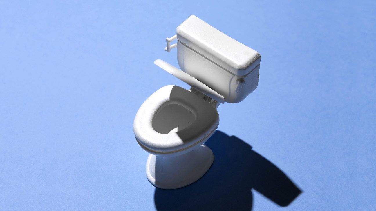 a toilet against a blue background