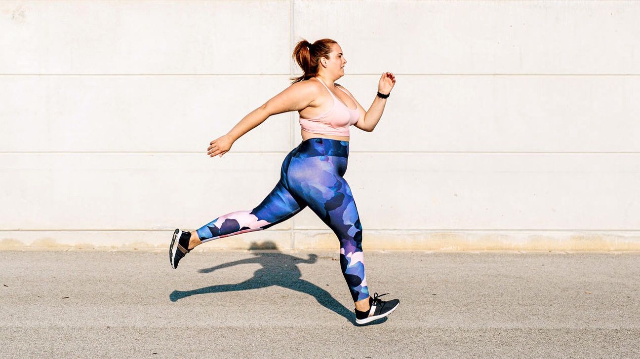 Stylish, overweight woman jogging