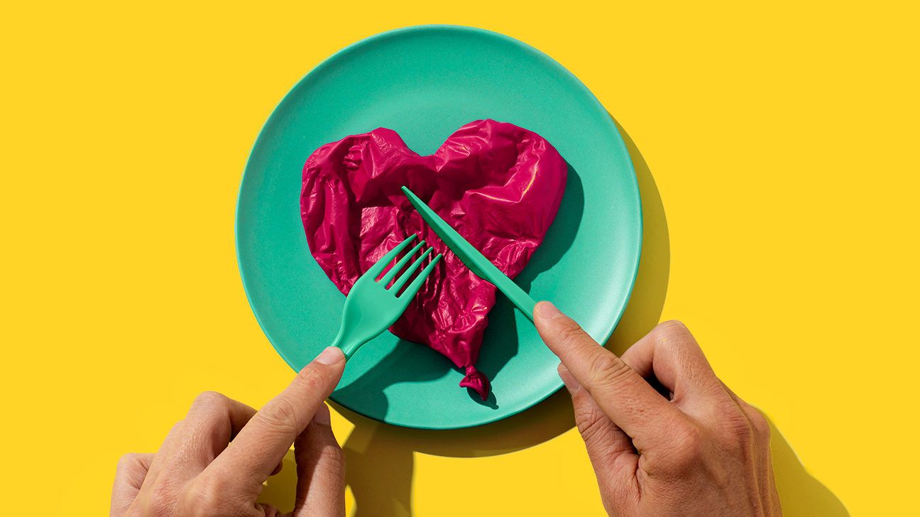 cutting a balloon heart on a plate