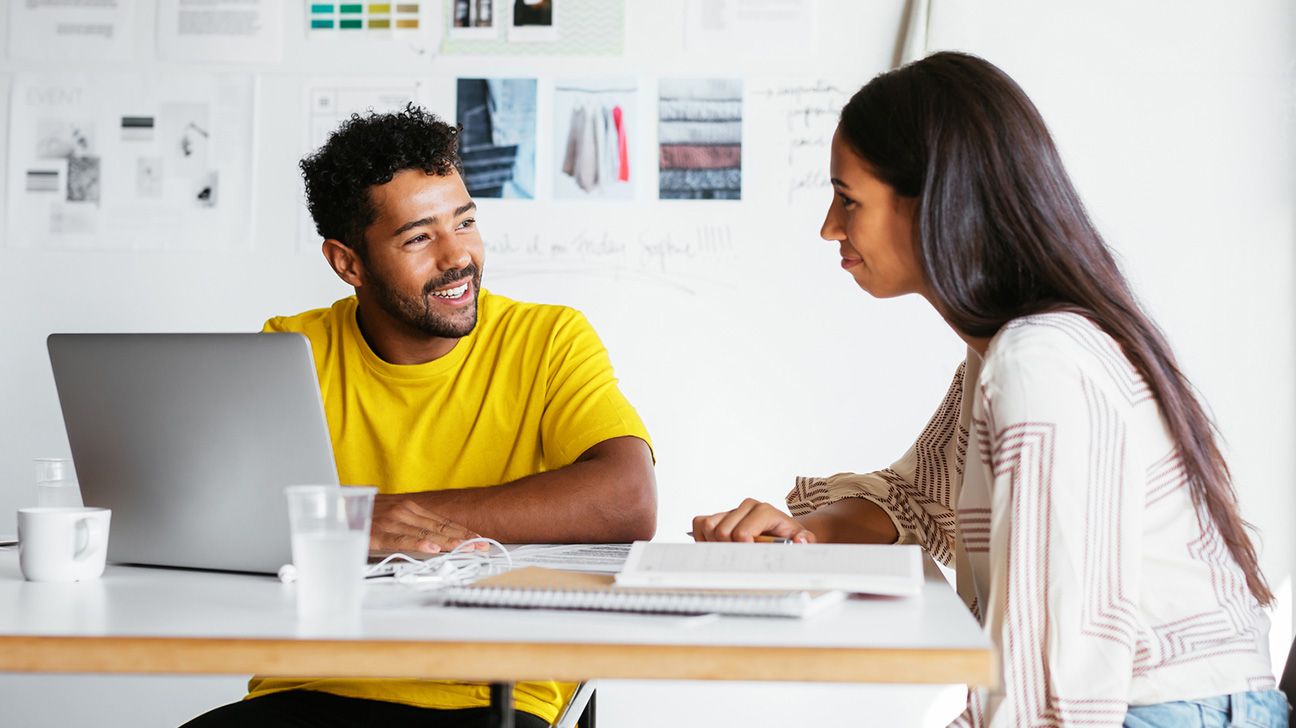 one coworker giving feedback to another