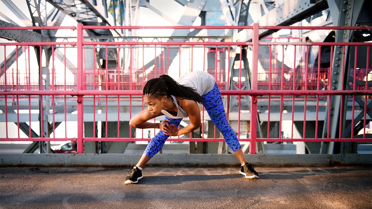 woman stretching before a workout