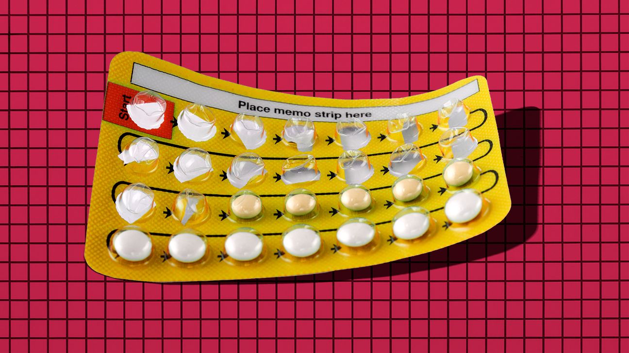 birth control pills on grid background