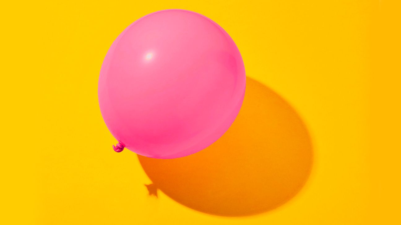 a pink balloon to represent gas and bloating