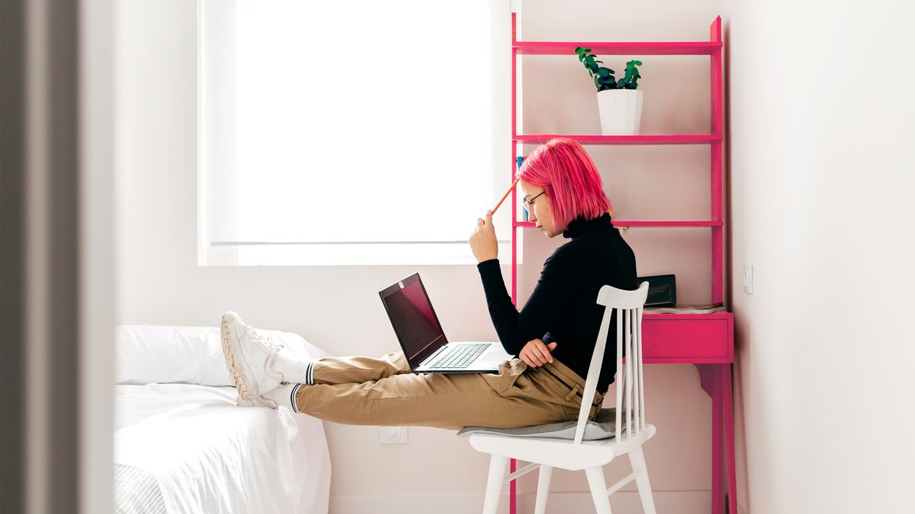 Woman in her bedroom working