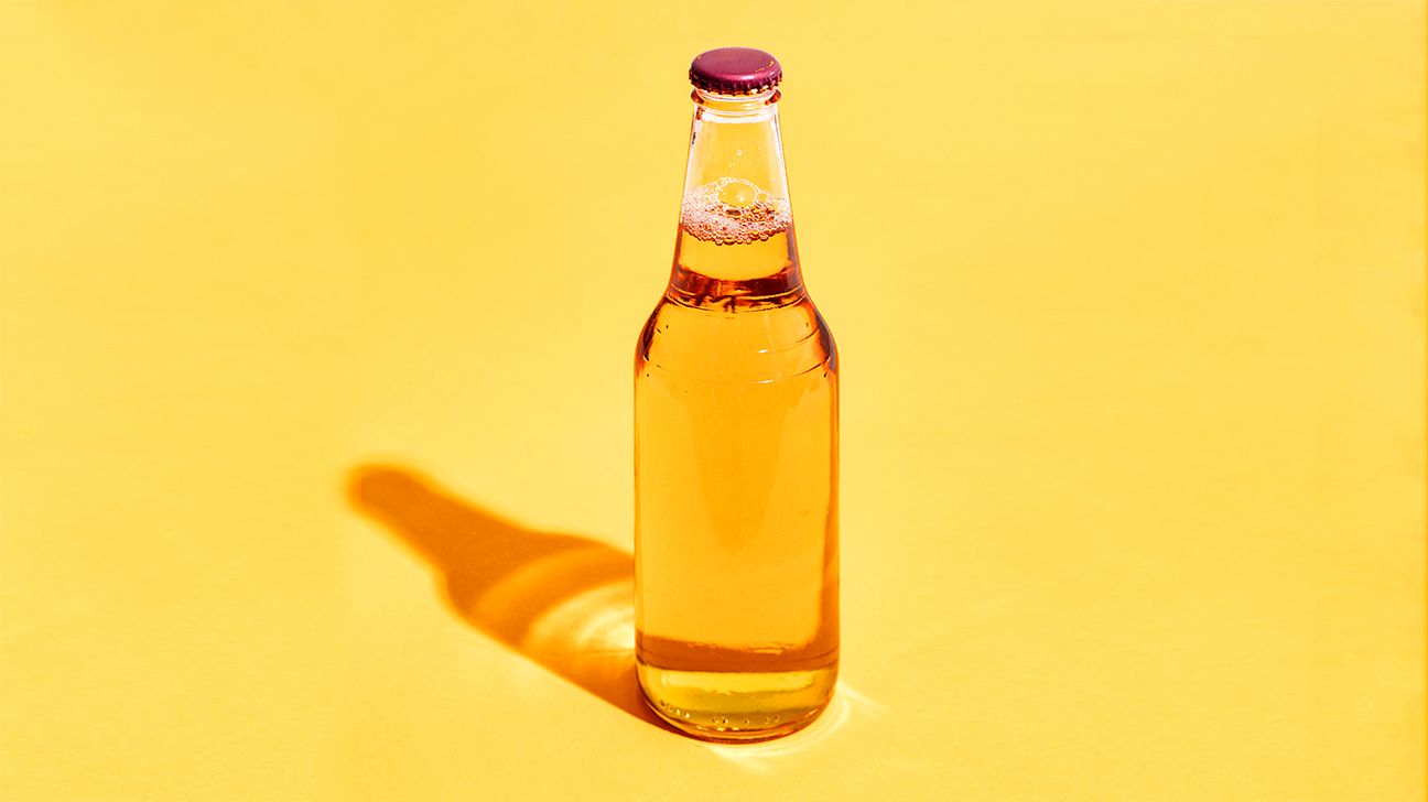 bottle of beer on a yellow background