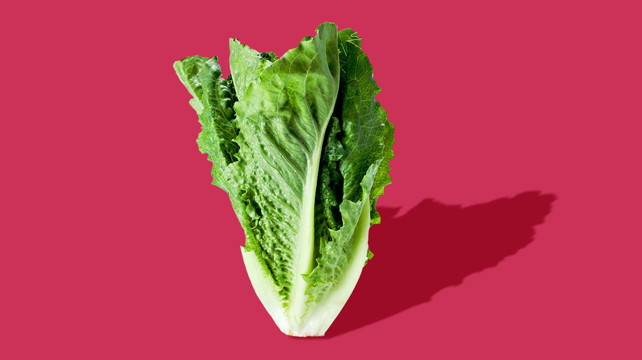 romaine lettuce on a pink background