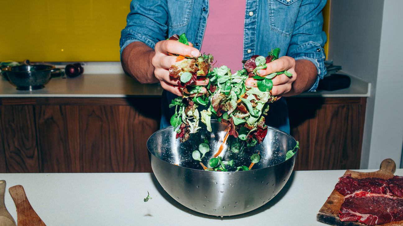 Man making a salad: Kitchen Hacks to Save Time
