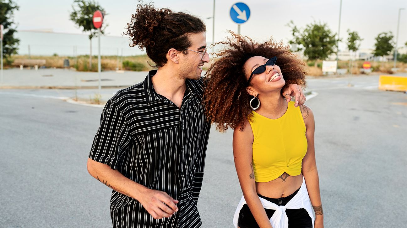 smiling couple with curly hair