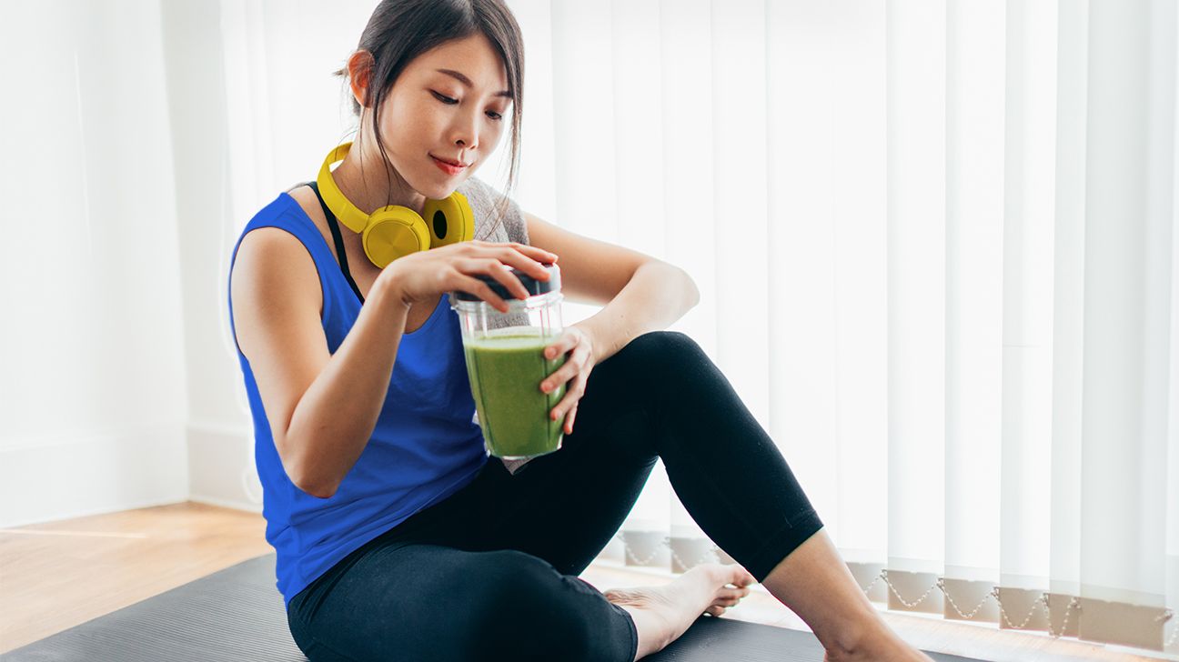 Young woman having a protein shake after a workout