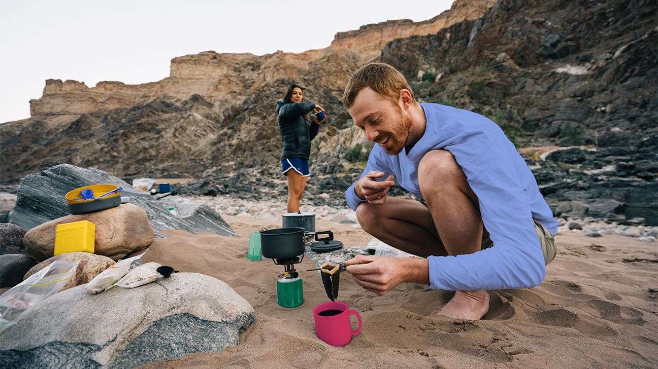 Man making coffee while camping