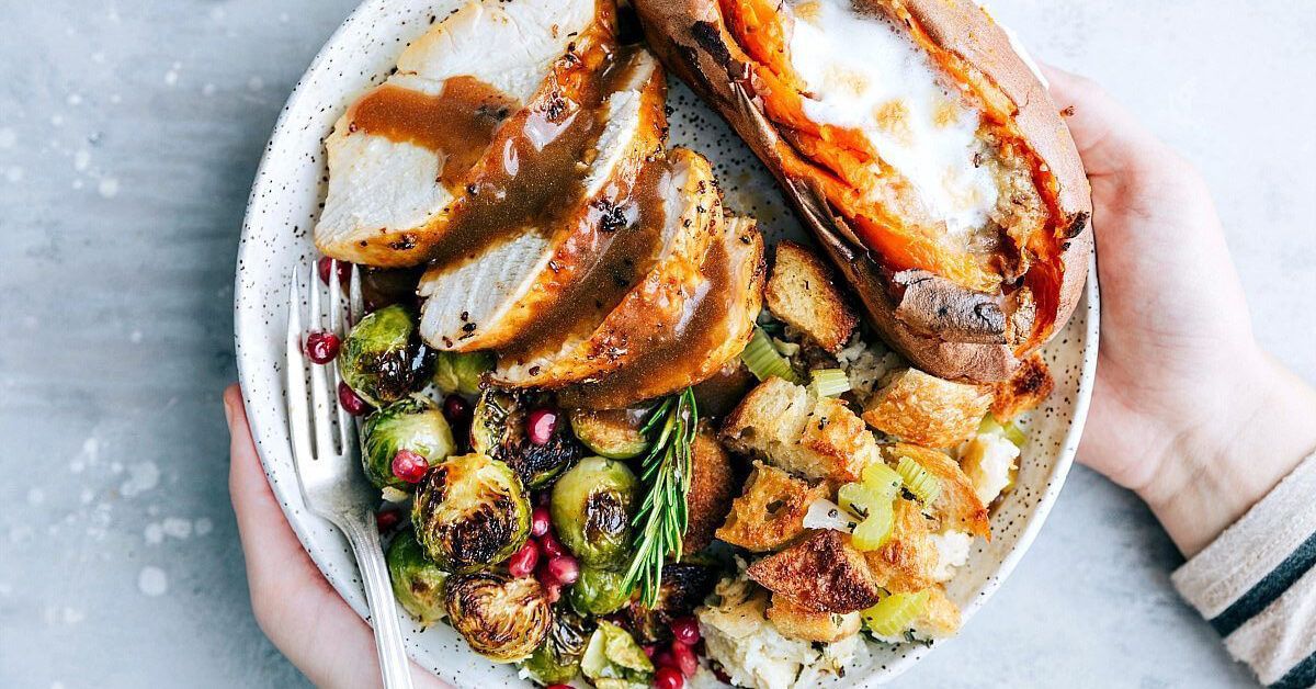 https://media.post.rvohealth.io/wp-content/uploads/sites/2/2020/09/GRT-204299-thanksgiving-for-two-Thanksgiving-Dinner-on-2-Sheet-Pans-Chelseas-Messy-Apron-1200x628-facebook-1200x628.jpg