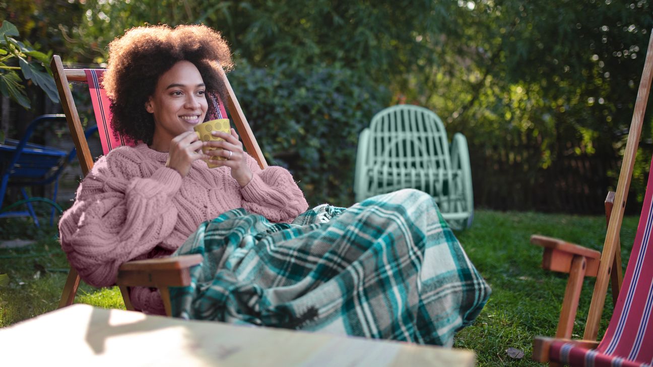 woman enjoying holiday dish outside header