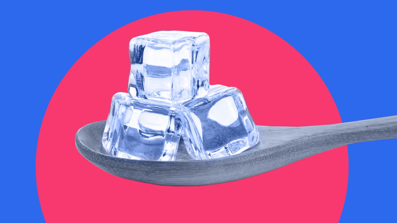 Ice cubes on spoon on red and blue background header