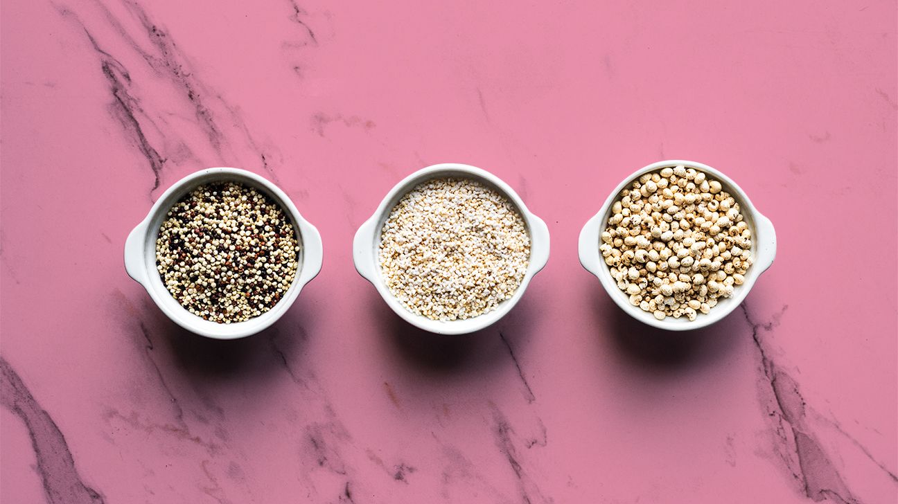 bowls of low carb grains on pink background header