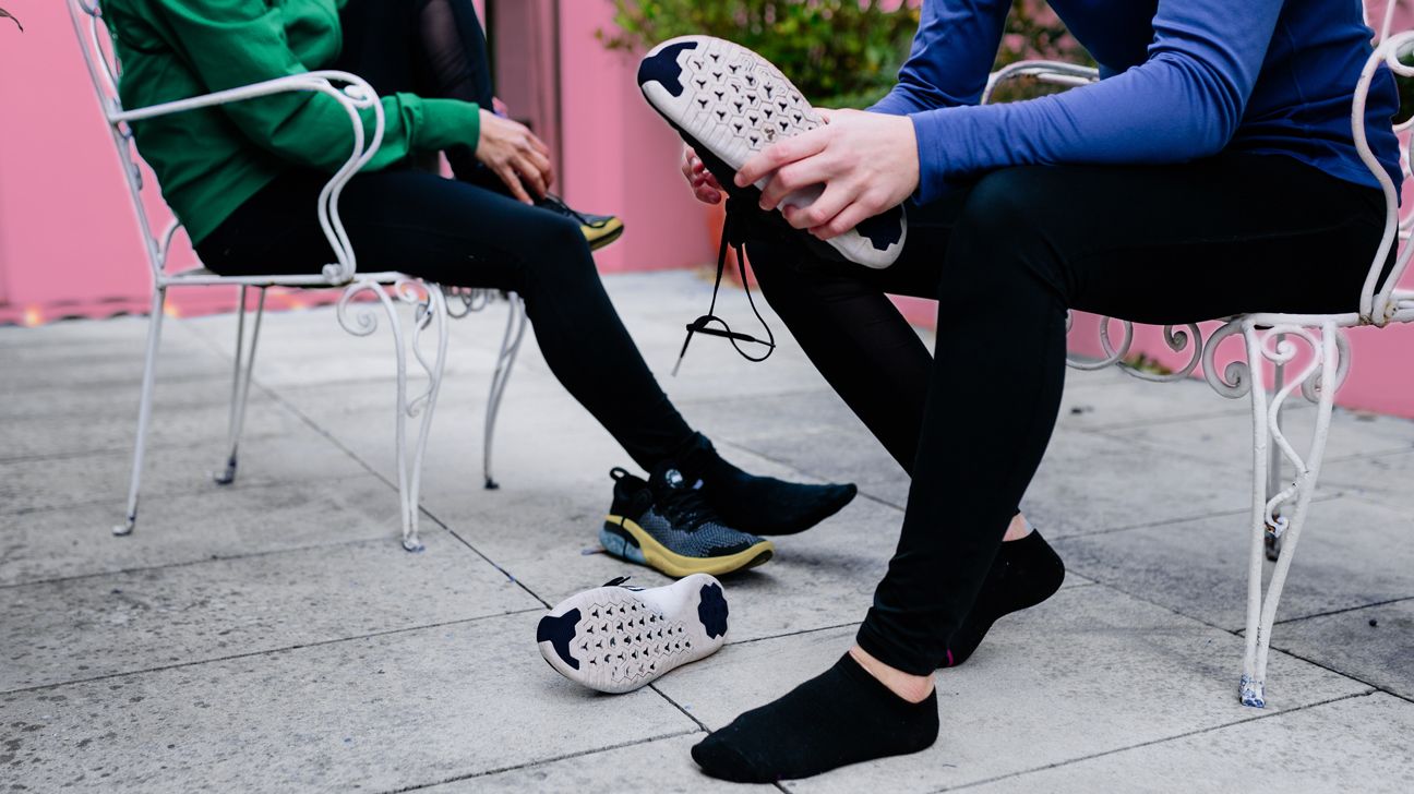 person putting on shoes after bodyweight workout header