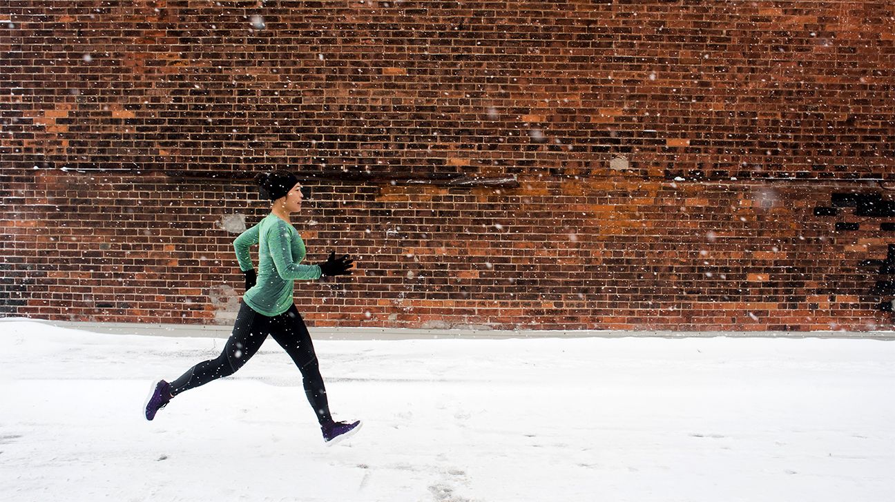 Woman running in the snow