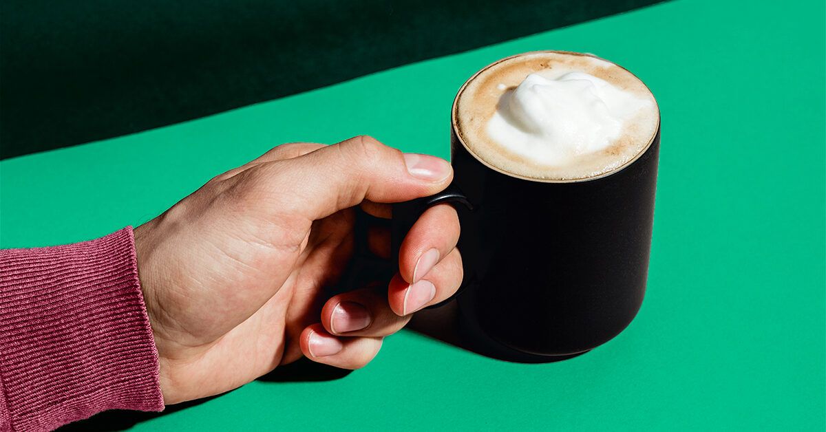 https://media.post.rvohealth.io/wp-content/uploads/sites/2/2020/11/GRT-hand-holding-coffee-with-froth-1200x628-facebook-1200x628.jpg