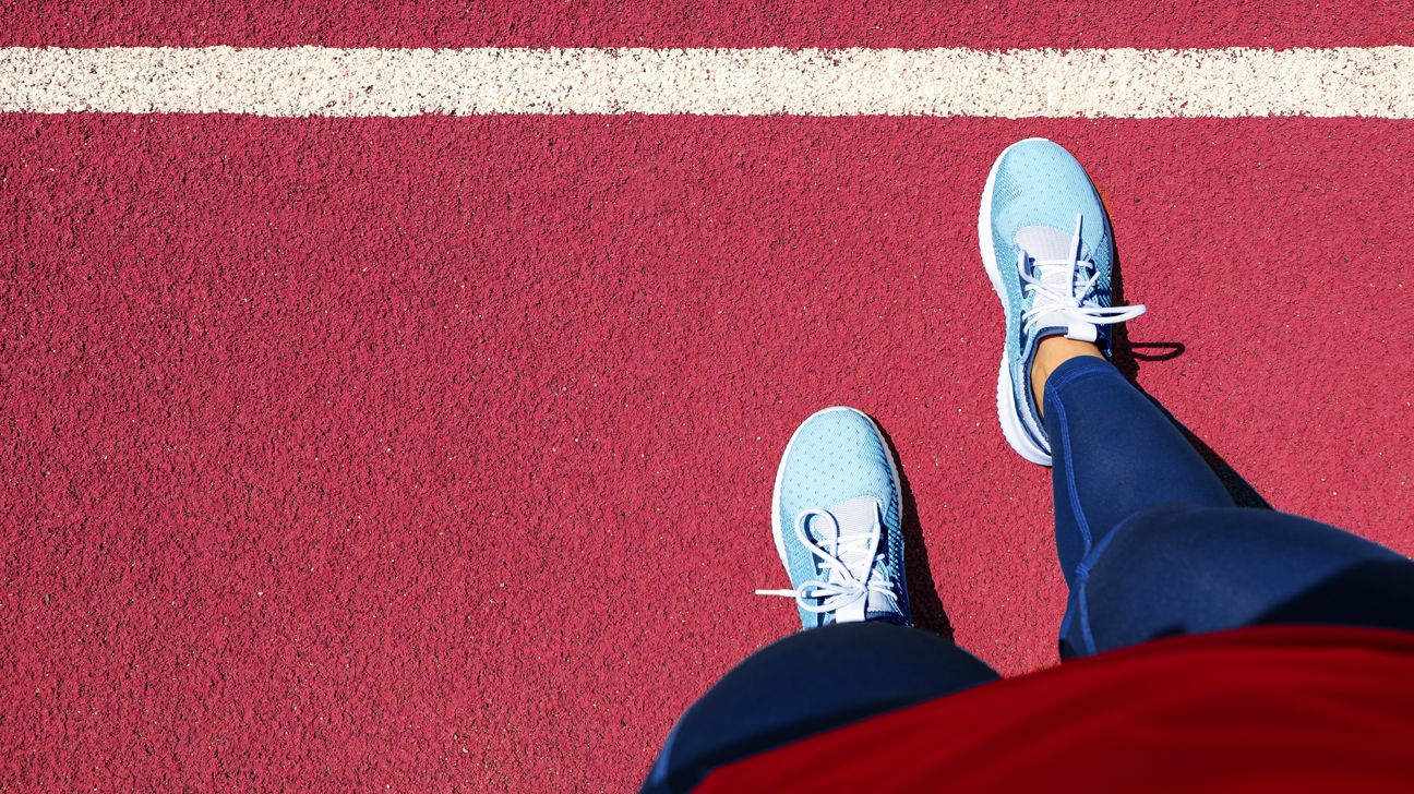 person looks at feet feeling anxiety which could cause weight loss or gain header