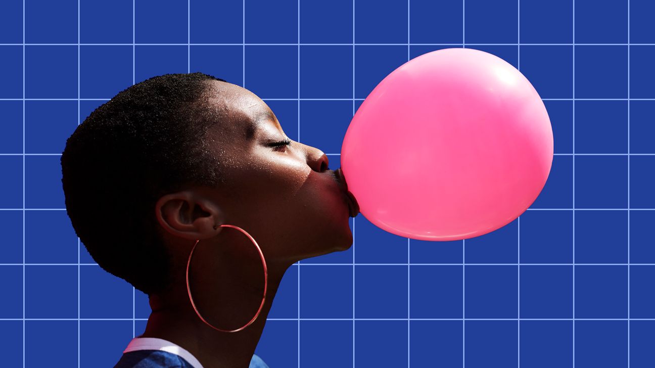 Woman blowing pink bubble because she's confident and awesome header