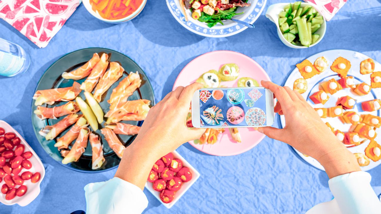 person capturing food on phone for noom header