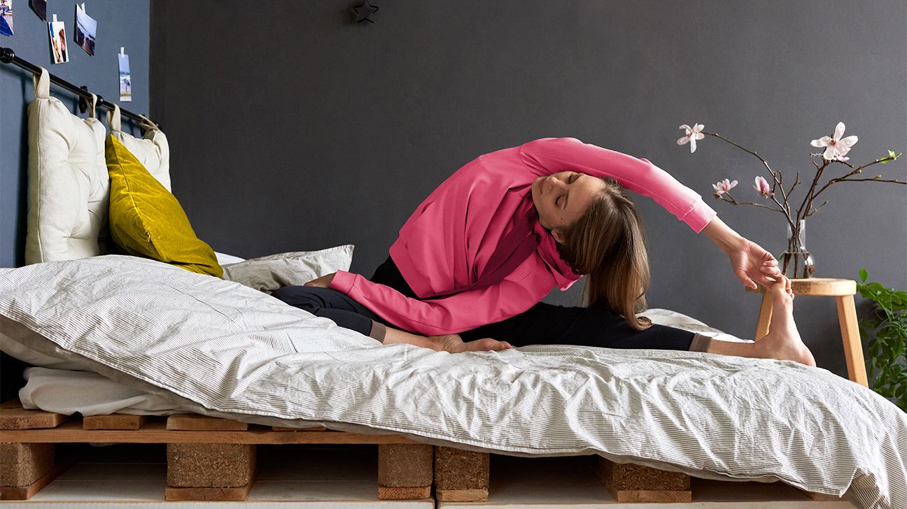 12 Yoga Stretches You Can Do in Bed