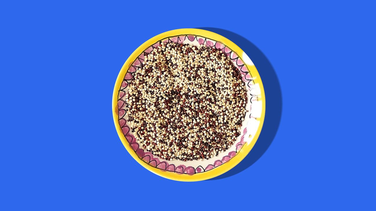 bowl of quinoa on a blue background