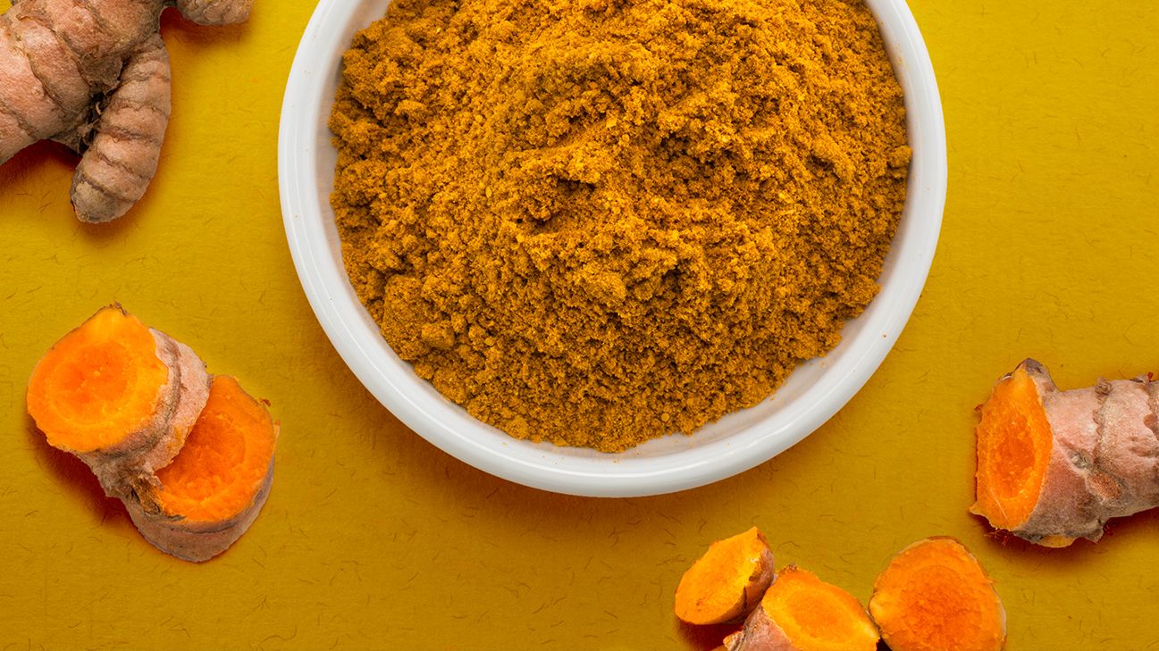 bowl of turmeric for migraine header