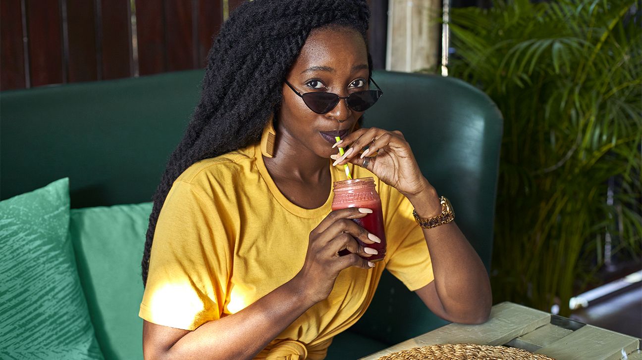 young woman with hidradentis superativa drinking a smoothie