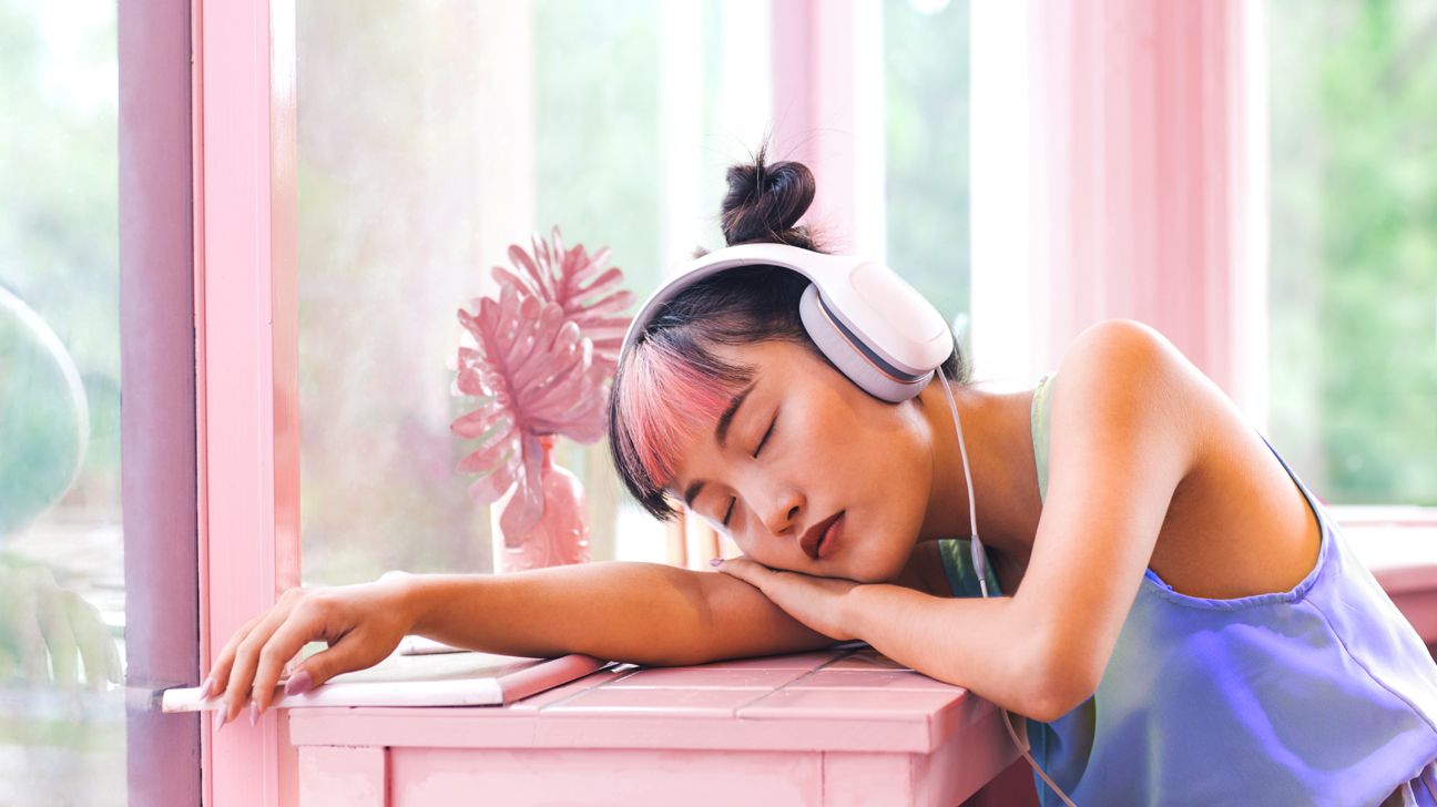 Woman listening to Meditative Throwback Playlist