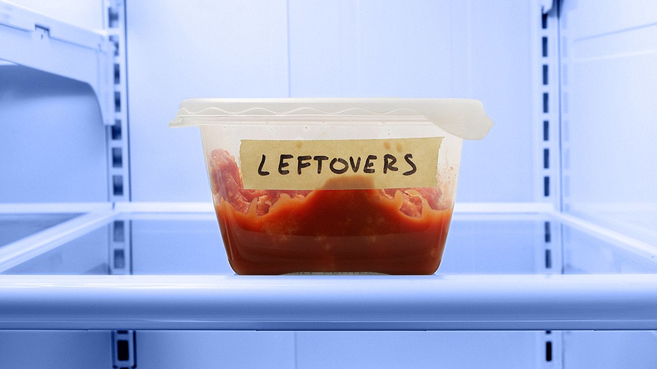 a container of leftovers in a fridge