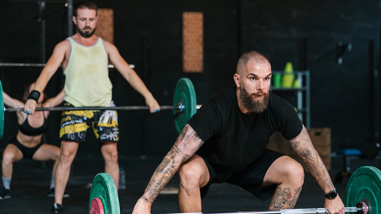 How can you keep your lower back safe while lifting heavy objects