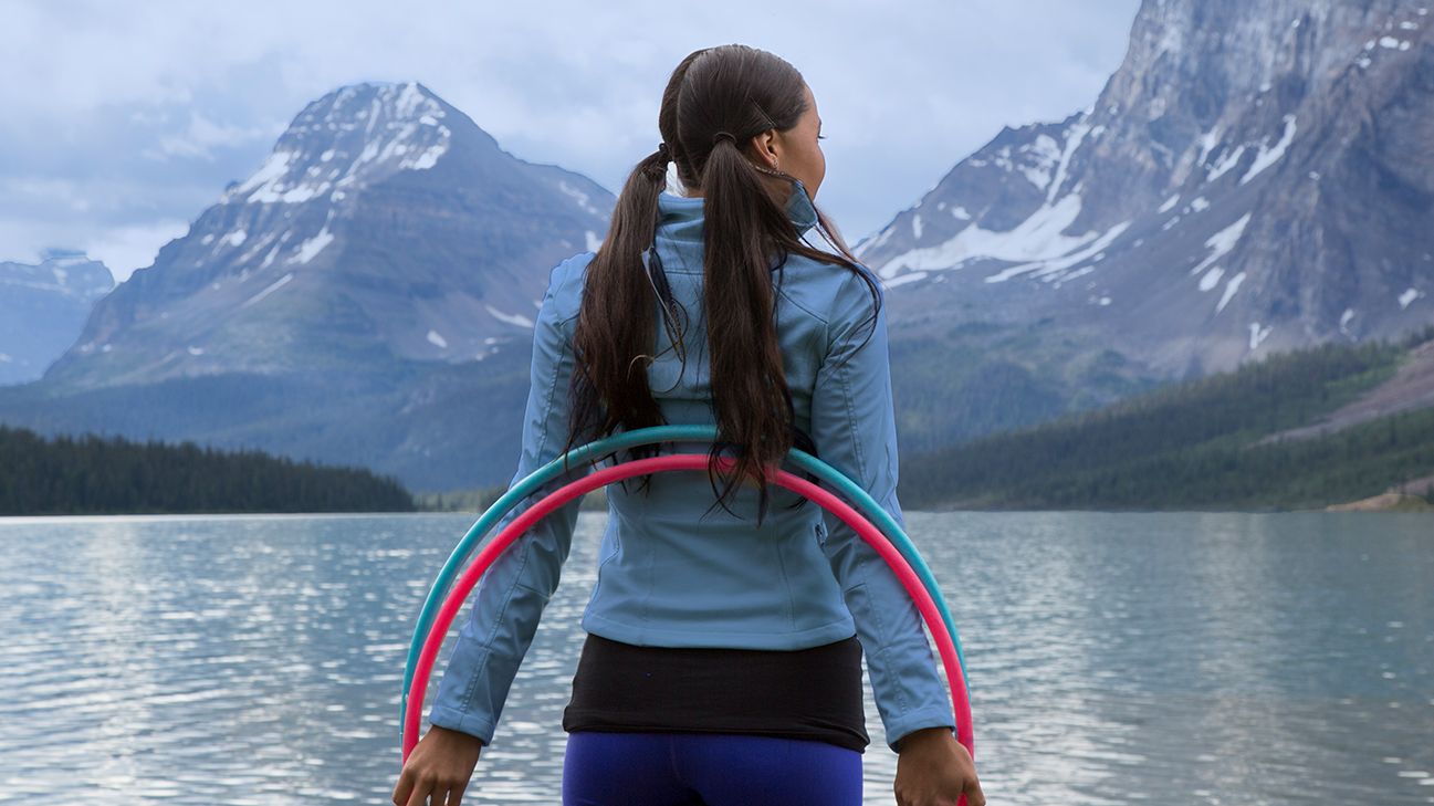 person on a health and wellness retreat near mountains and a lake