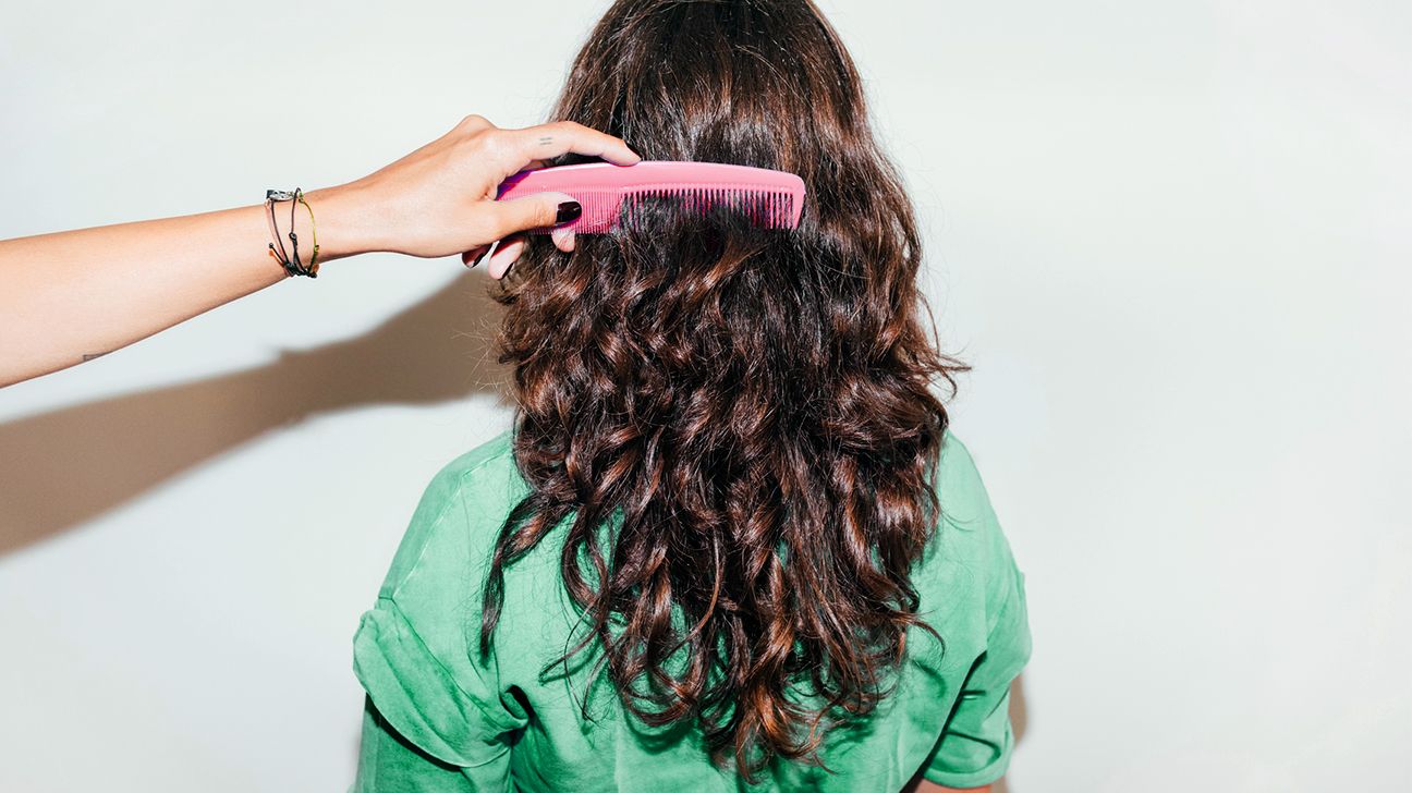 woman combing thick hair header