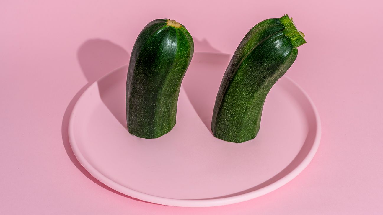 Raw zucchini on pink plate header