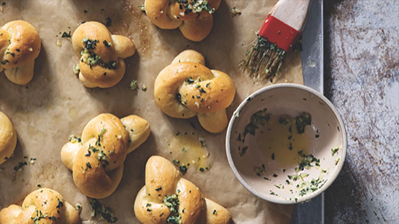 Garlic knots on a baking sheet