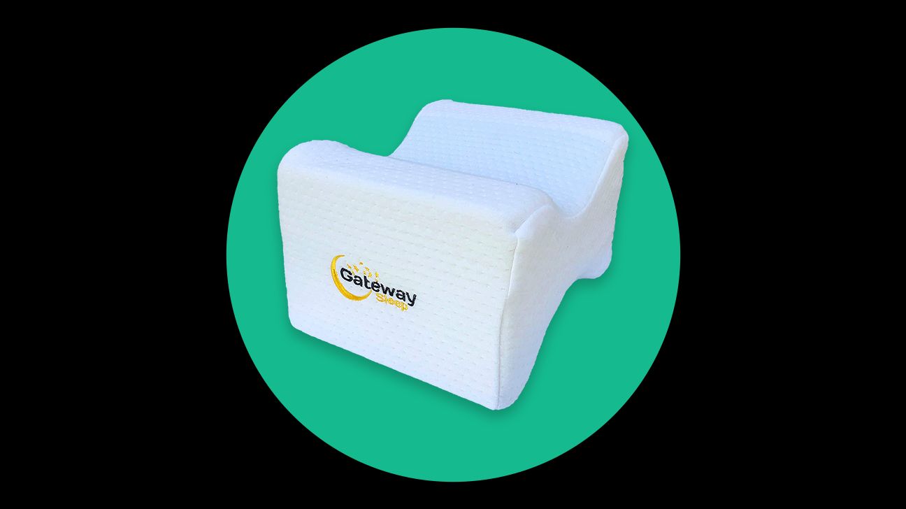 https://media.post.rvohealth.io/wp-content/uploads/sites/2/2021/10/412162-Memory-Foam-Knee-Pillow-with-Washable-Organic-Cover-for-Side-Sleepers.png