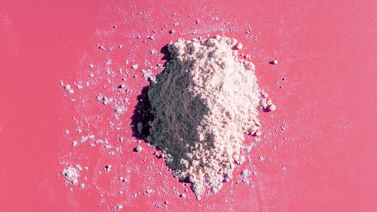 l arginine supplement on pink background