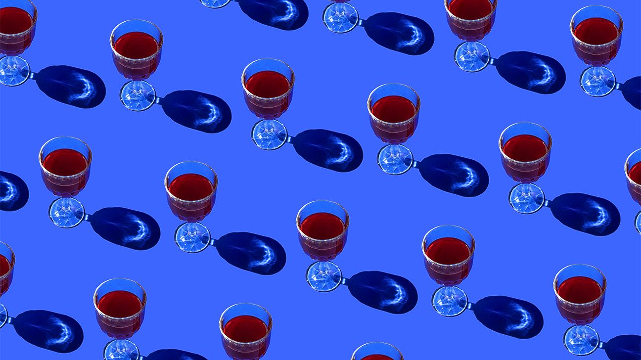 photos of red wine in glasses on blue background