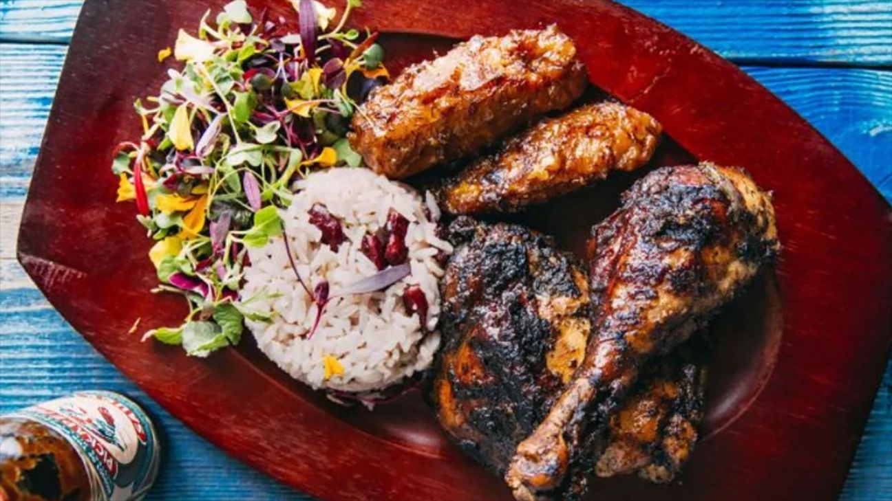 Jerk chicken with rice and salad