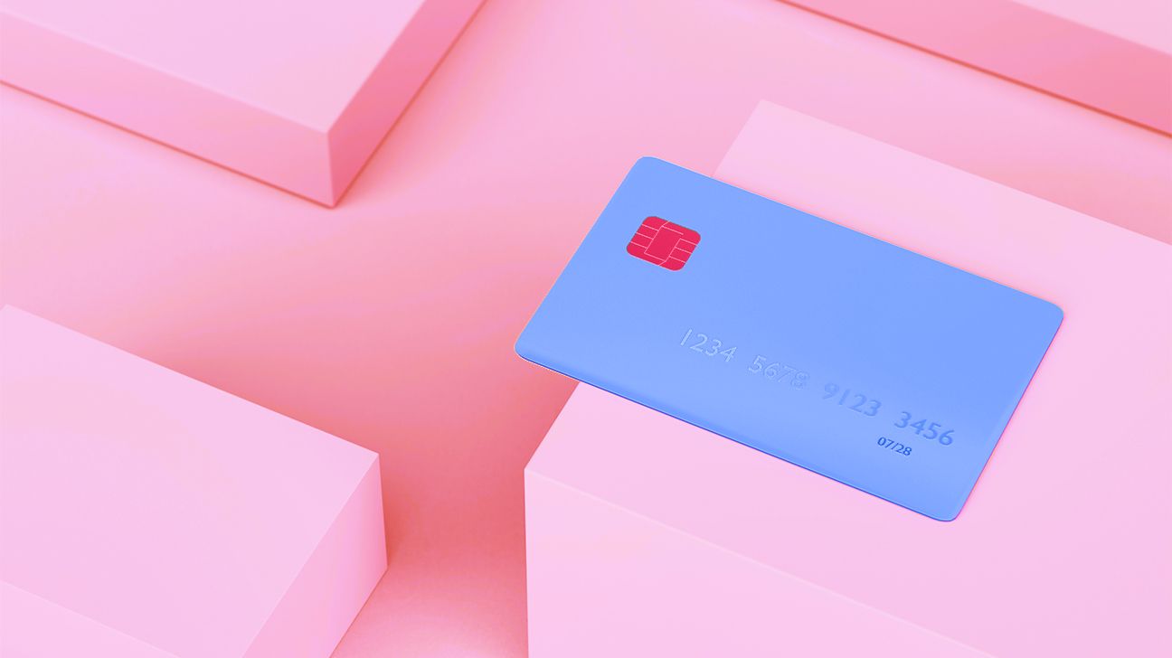 blue credit card on pink background