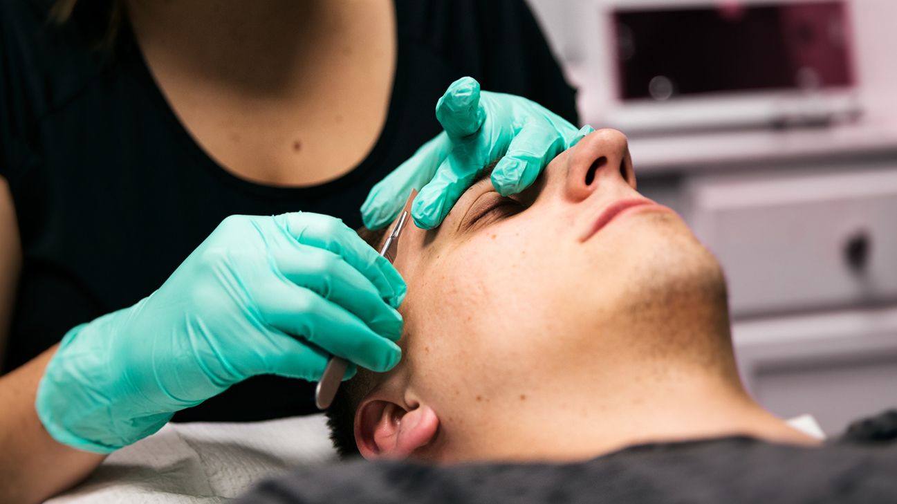 person getting dermaplaning facial