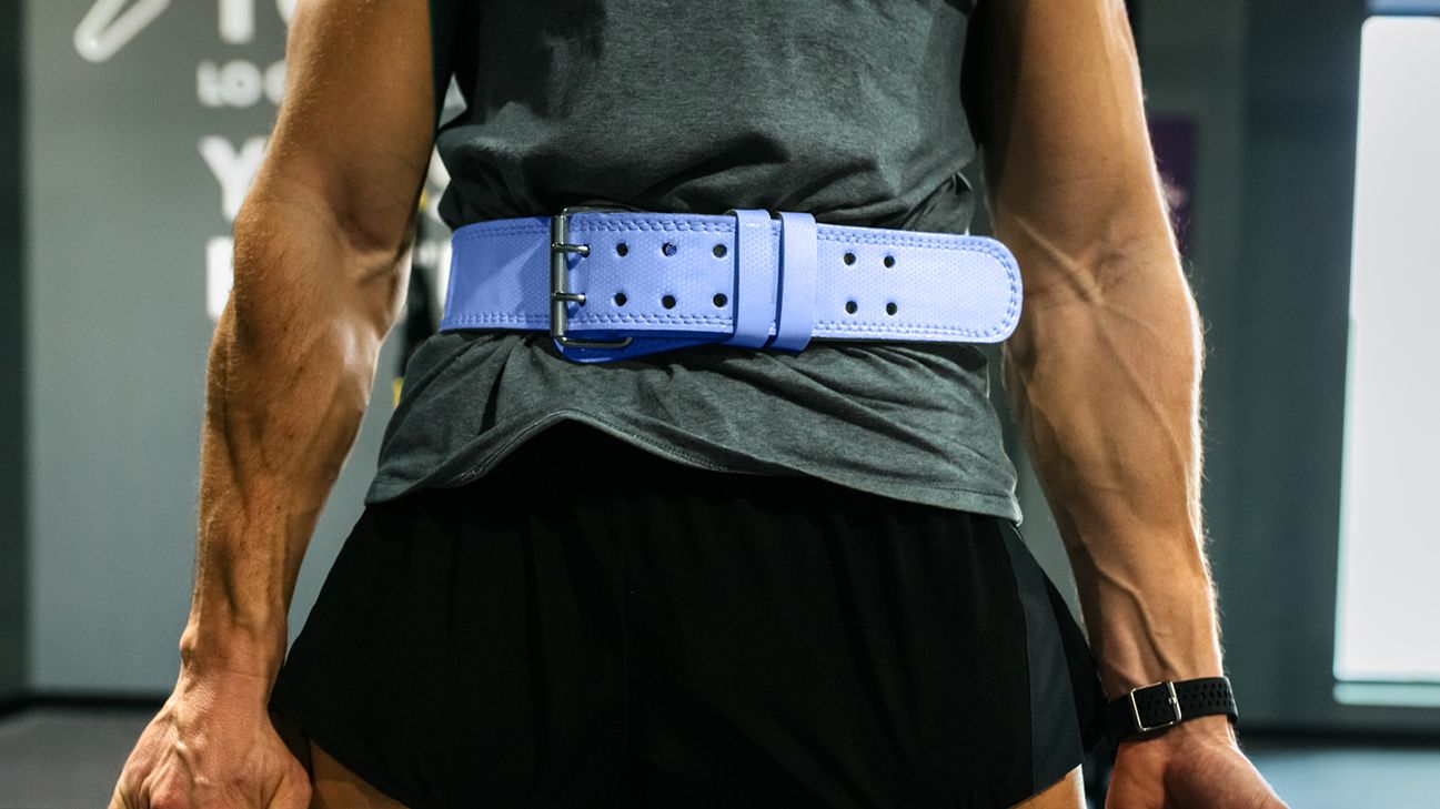 person wearing weightlifting belt and accessories header