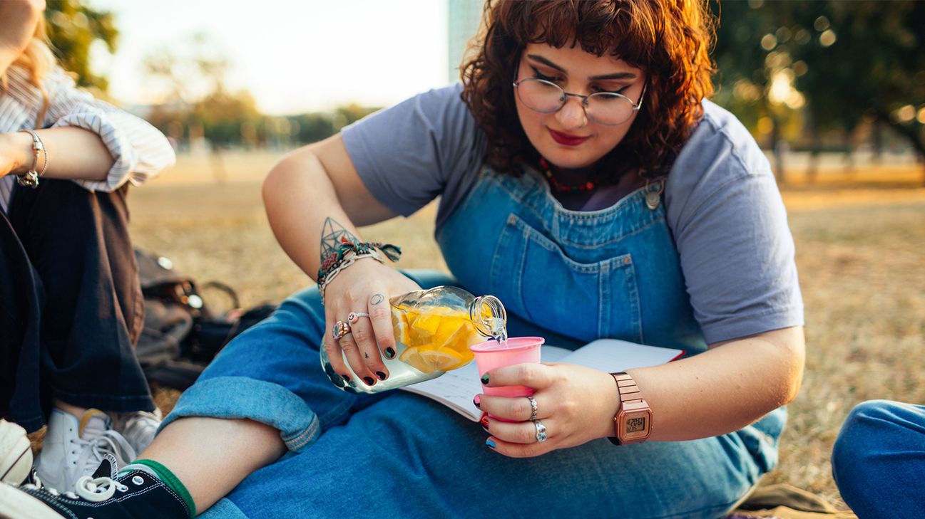 woman hydrating with fluids header