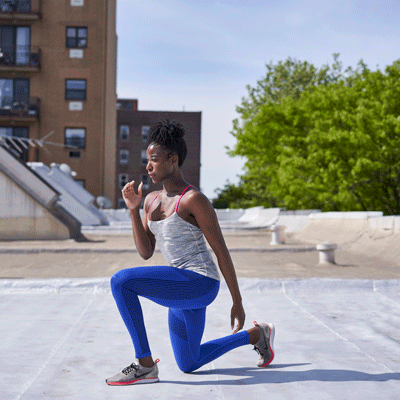 person doing lunges on a rooftop