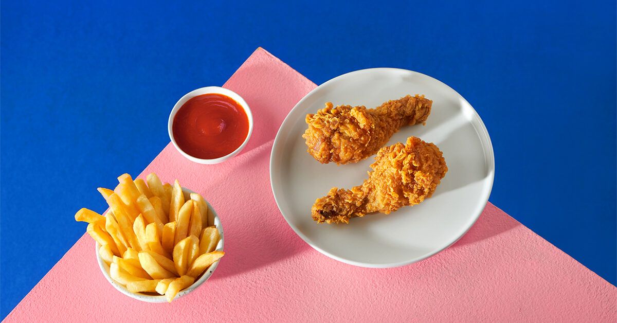 https://media.post.rvohealth.io/wp-content/uploads/sites/2/2022/01/GRT-fried-chicken-french-fries-1200x628-facebook-1200x628.jpg