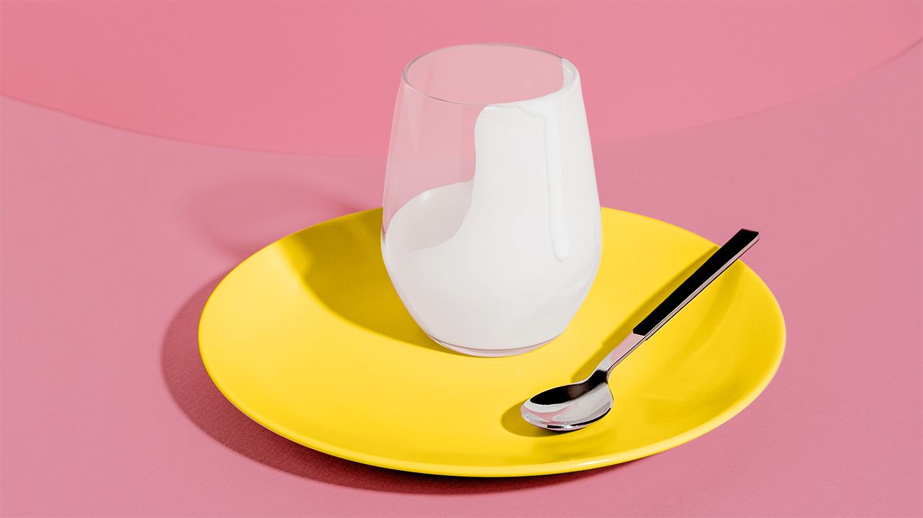 cup of yogurt on a yellow plate