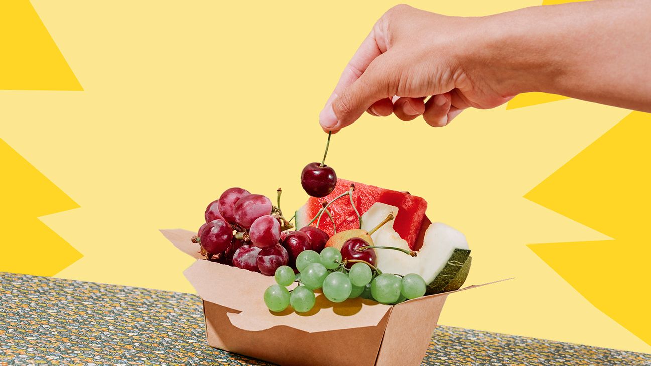 box full of grapes cherries and watermelon