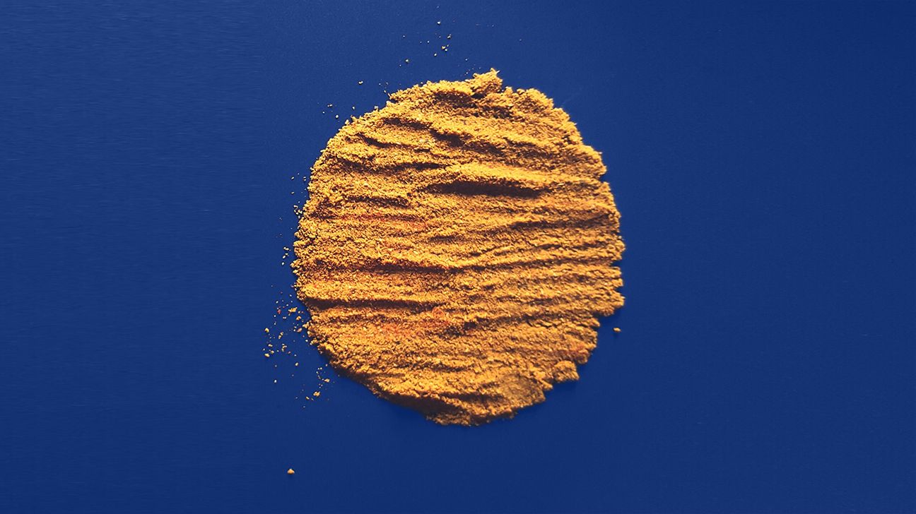 Garam masala powder on blue background