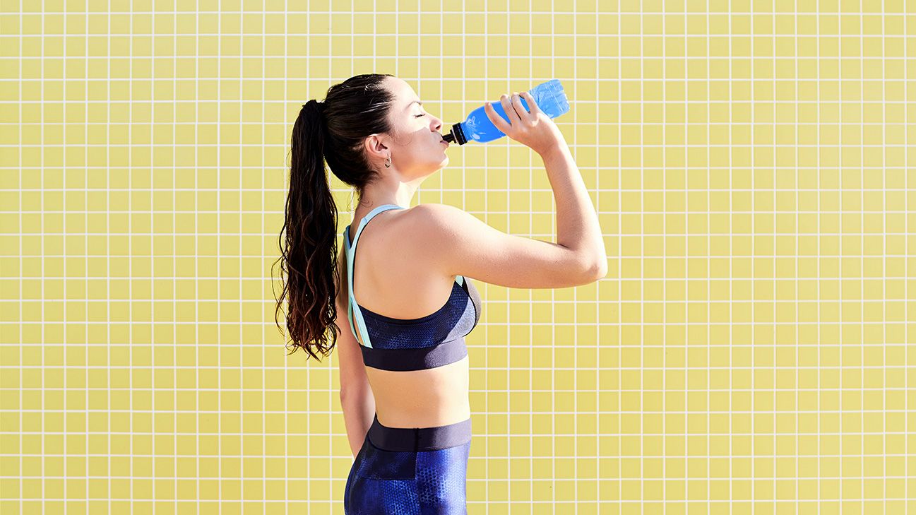 athlete drinking from bottle