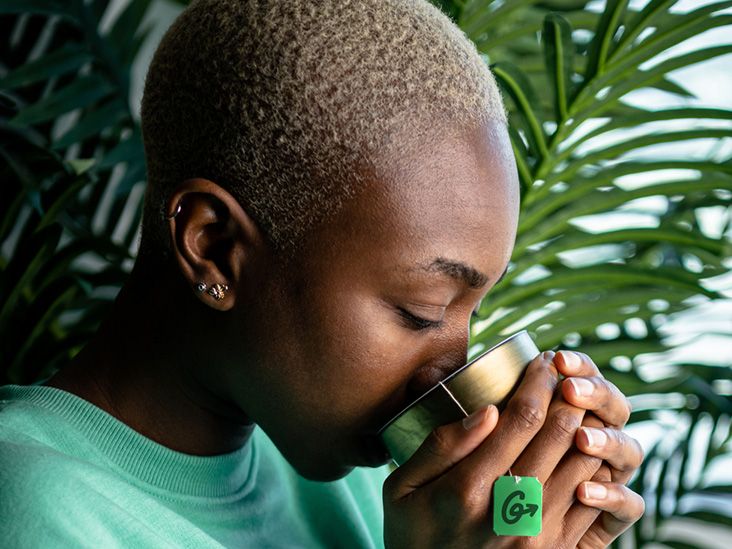 man drinking green tea